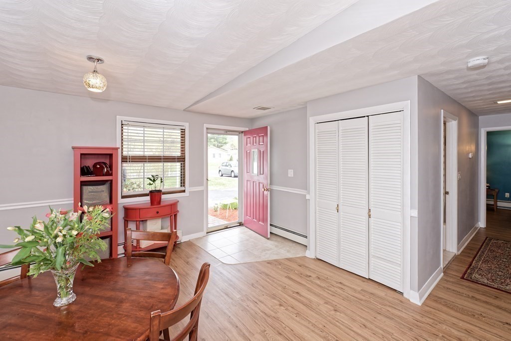 54 Gregory Road Framingham, MA 01701 - Photo 7 of 41 a living room with furniture a wooden floor and next to a window