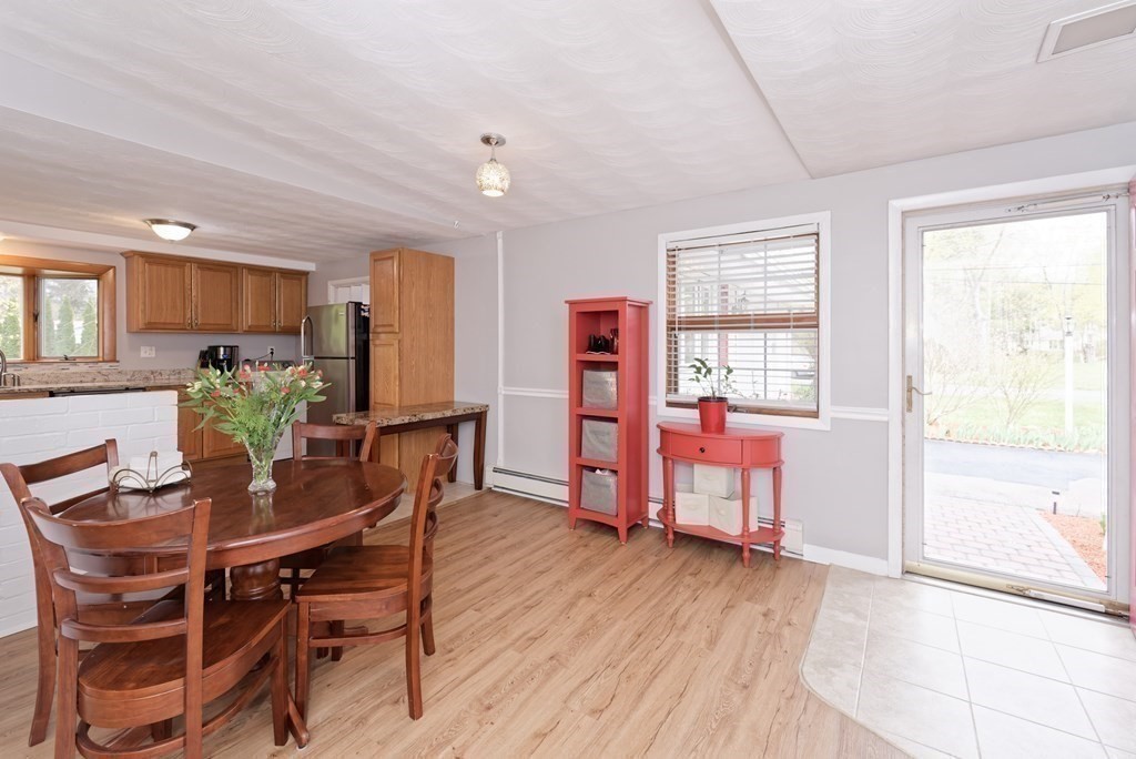 54 Gregory Road Framingham, MA 01701 - Photo 8 of 41 a view of a dining room with furniture and wooden floor