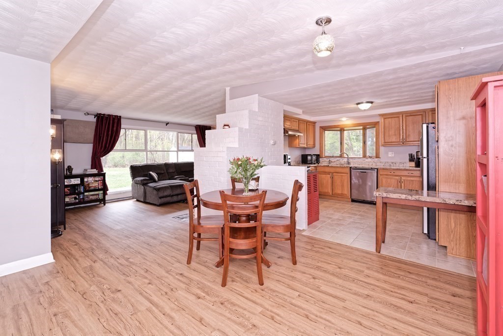 54 Gregory Road Framingham, MA 01701 - Photo 9 of 41 a view of a dining room with furniture and wooden floor