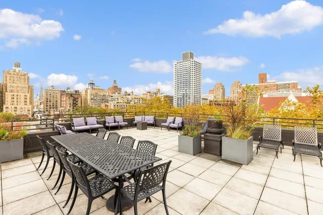a view of a wooden fence and trees