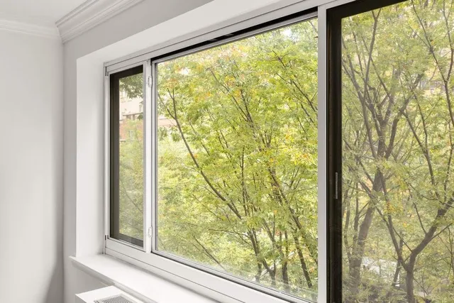 a view of a room with a large window