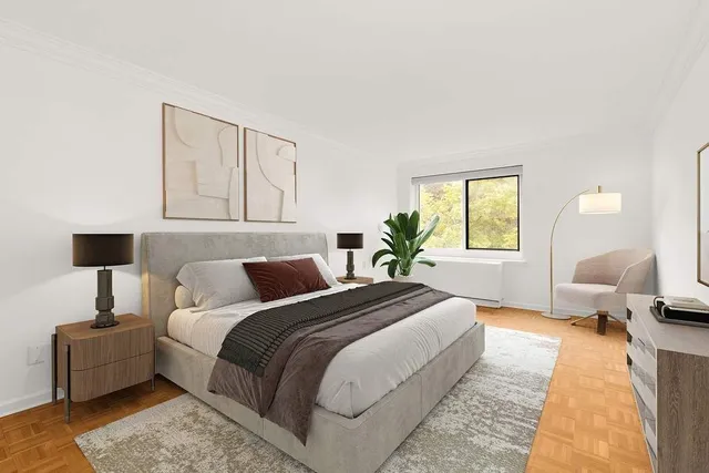 a bedroom with bed and a window