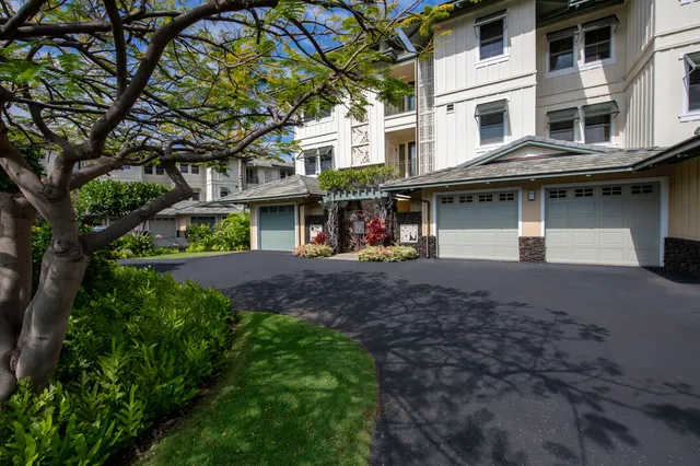 a front view of a building with garden