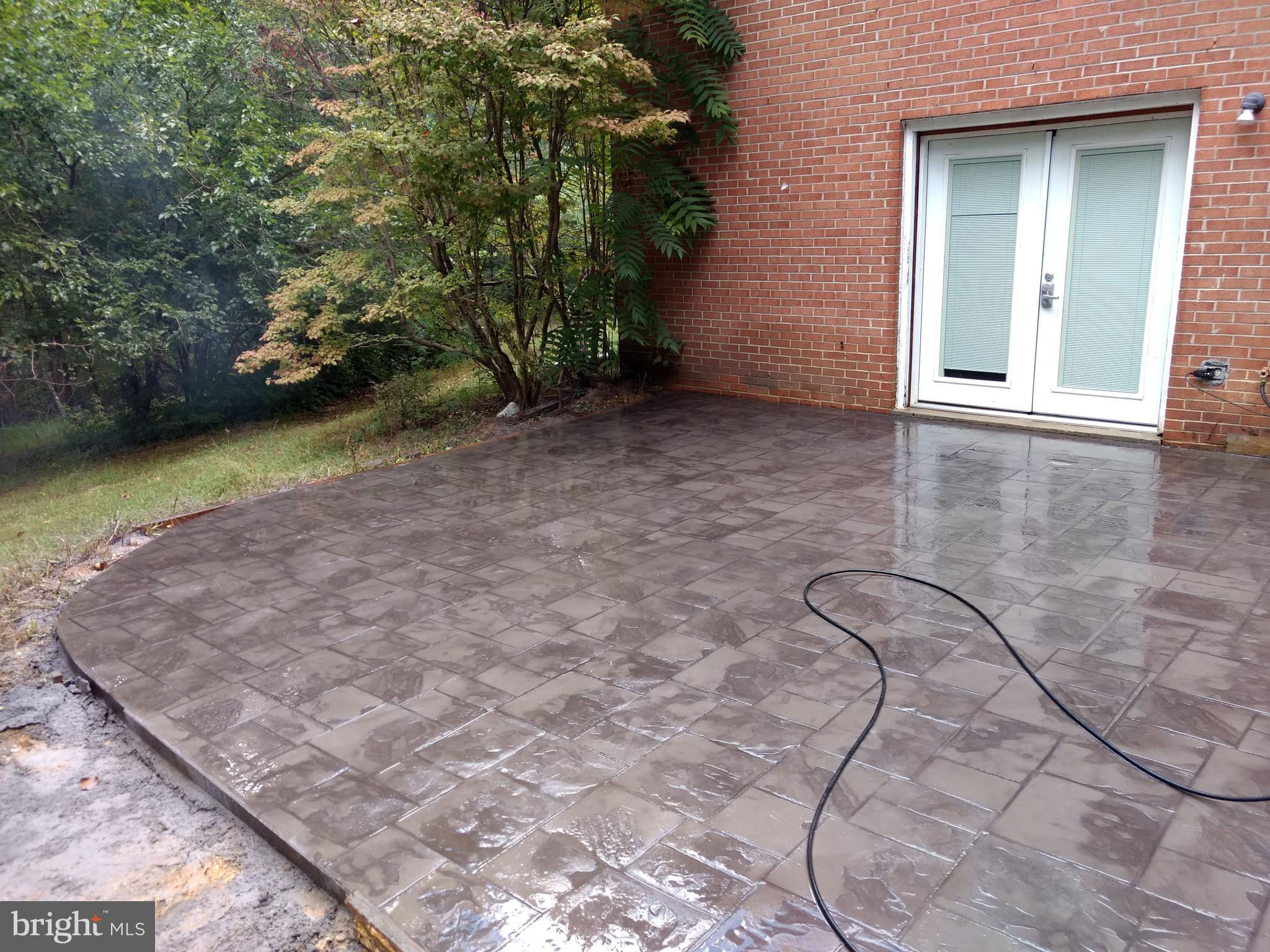 17017 Croom Road Brandywine, MD 20613 - Photo 2 of 2 Stamped Concrete back patio