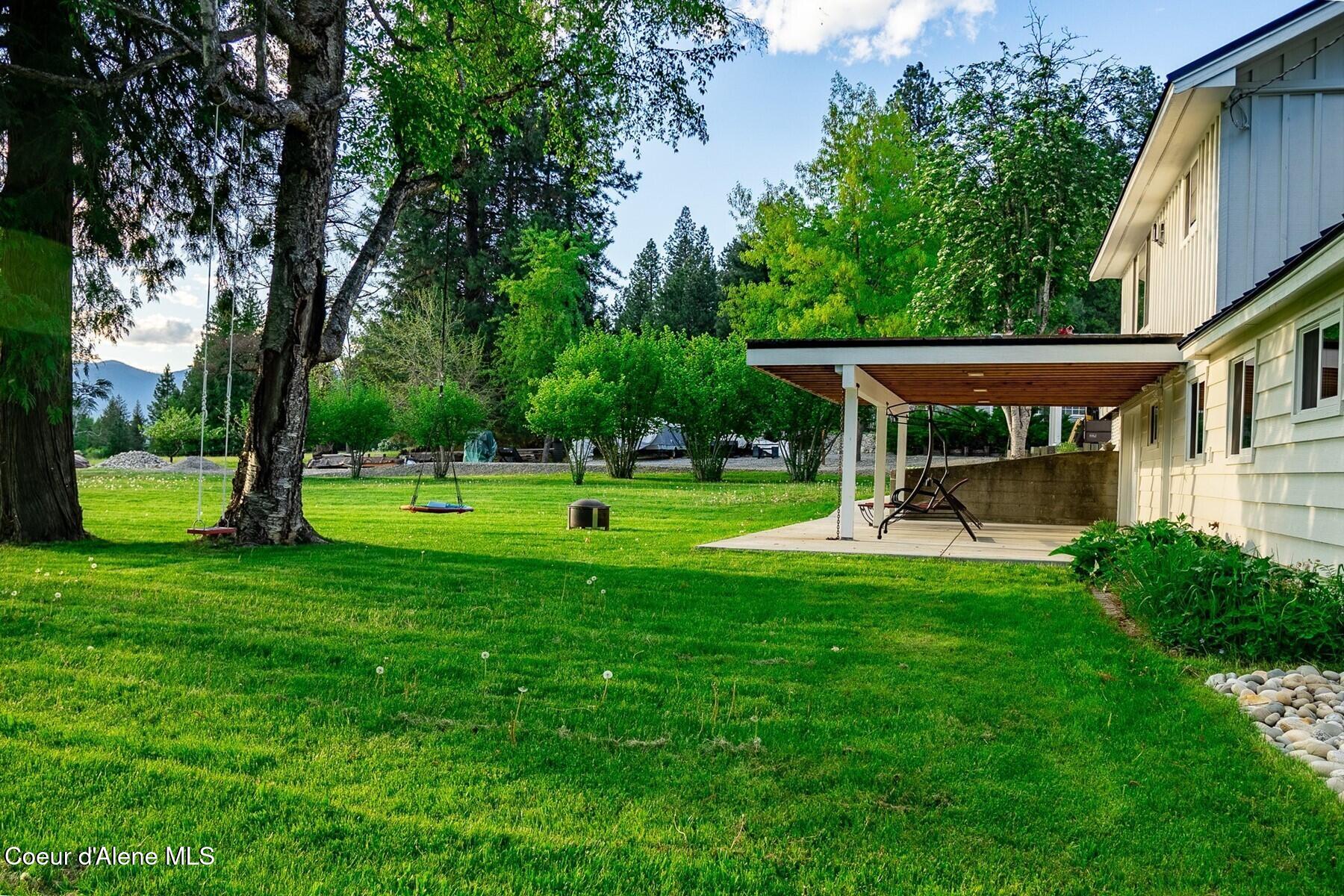 1041 Bottle Bay Road Sagle, ID 83860 - Photo 61 of 67 Backyard with a North Idaho vibe