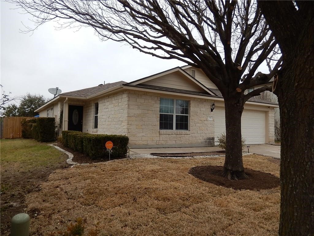 116 Rinehardt Street Hutto, TX 78634 - Photo 2 of 27 a front view of a house with garden