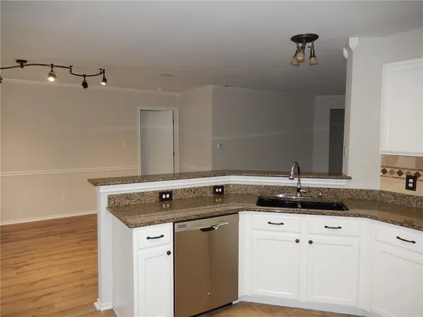 a view of a sink vanity and a mirror