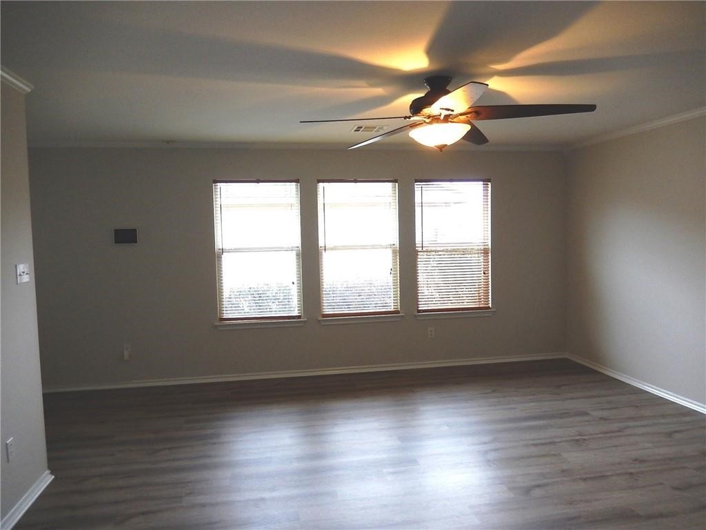 116 Rinehardt Street Hutto, TX 78634 - Photo 9 of 27 a view of empty room with wooden floor and fan