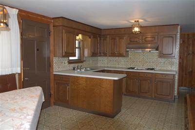 631 Quaker Road North Falmouth, MA 02556 - Photo 9 of 19 a bathroom with a granite countertop sink a mirror and a bathtub