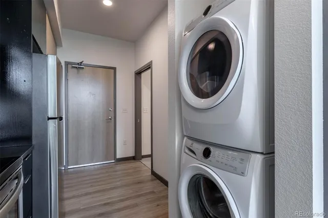 a view of a hallway with washer and dryer