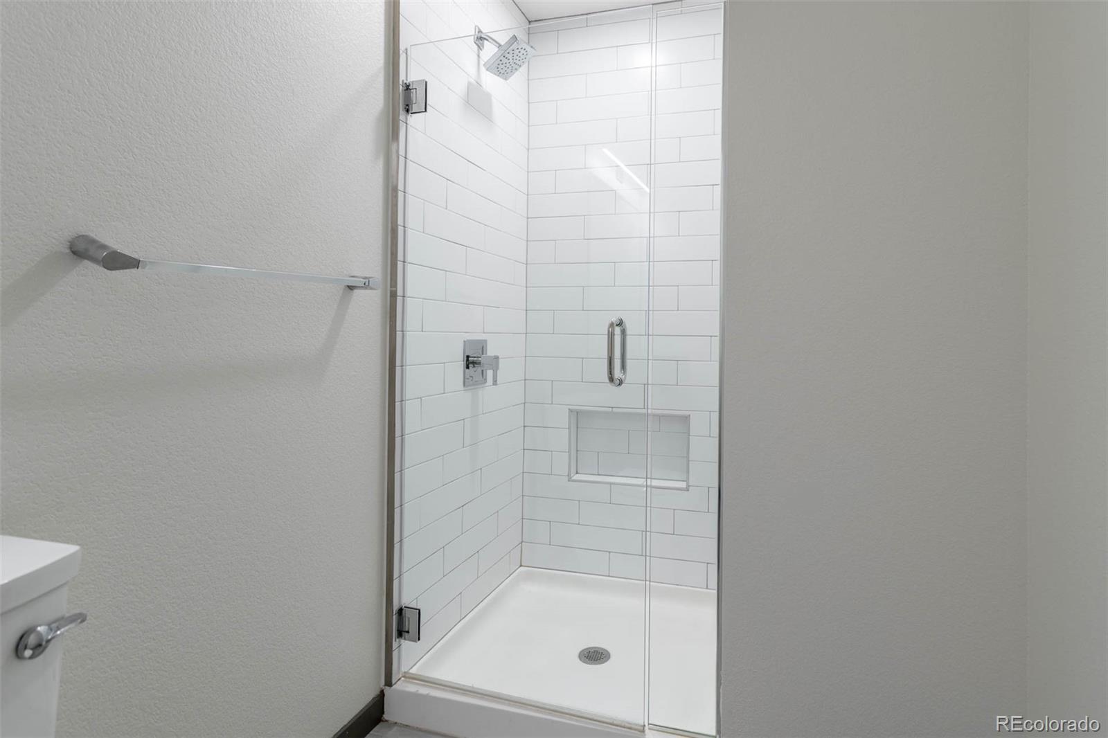 603 Inca Street, Unit 313 Denver, CO 80204 - Photo 16 of 20 a bathroom with a shower
