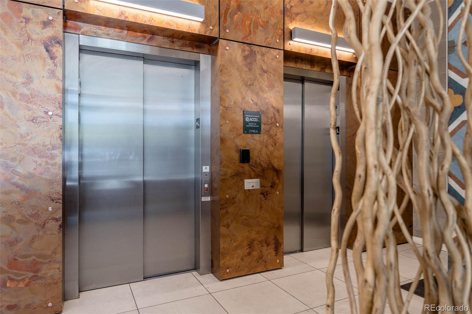 603 Inca Street, Unit 313 Denver, CO 80204 - Photo 6 of 20 a bathroom with a glass door shower