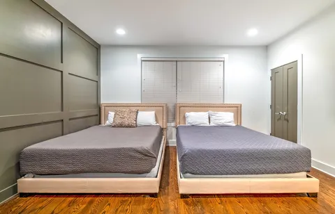 a bedroom with furniture and a window