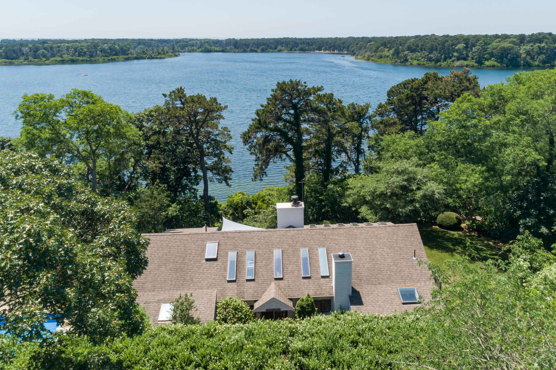 an aerial view of a house with a lake view