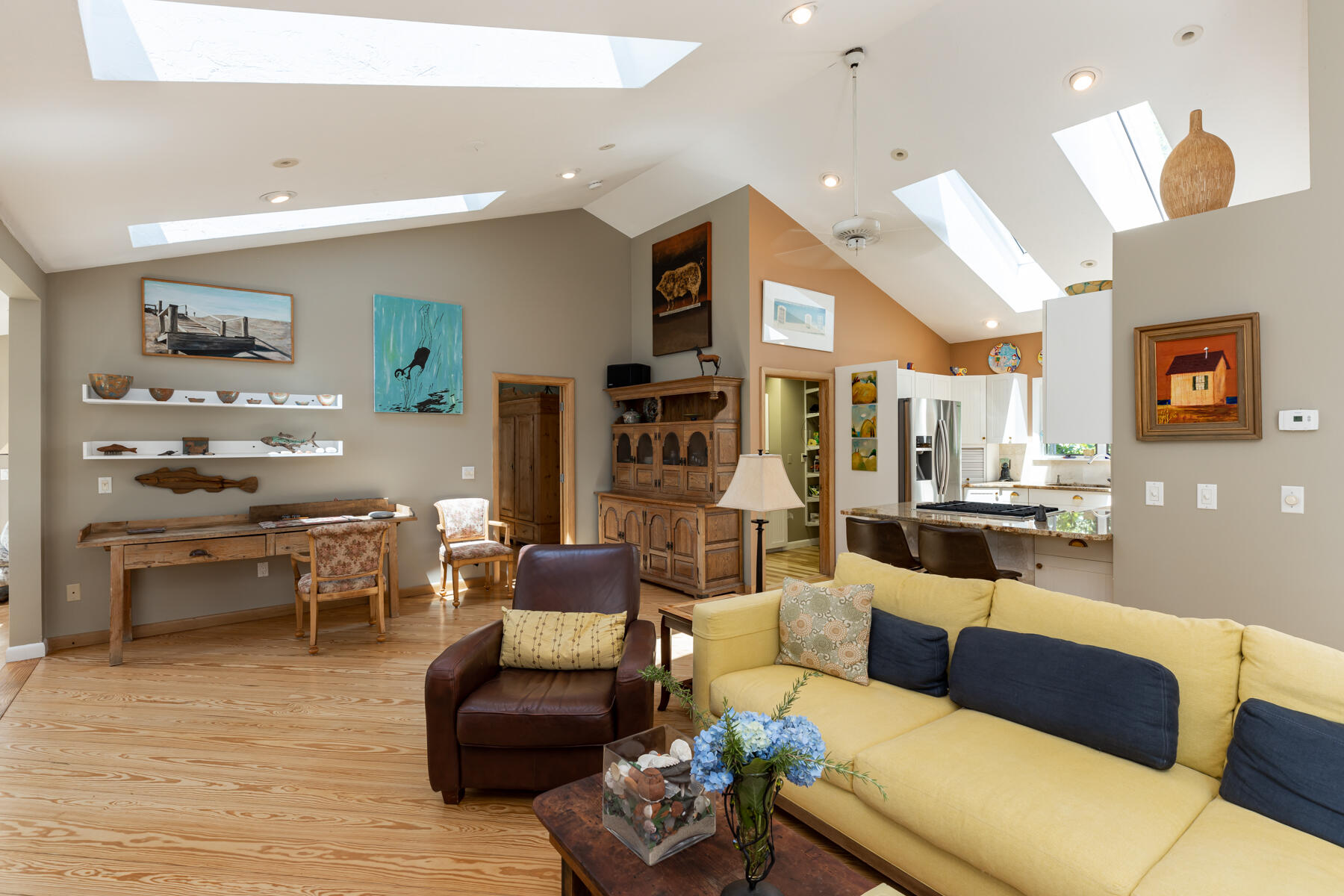 25 Adams Way Eastham, MA 02642 - Photo 11 of 60 a living room with furniture kitchen view and a wooden floor