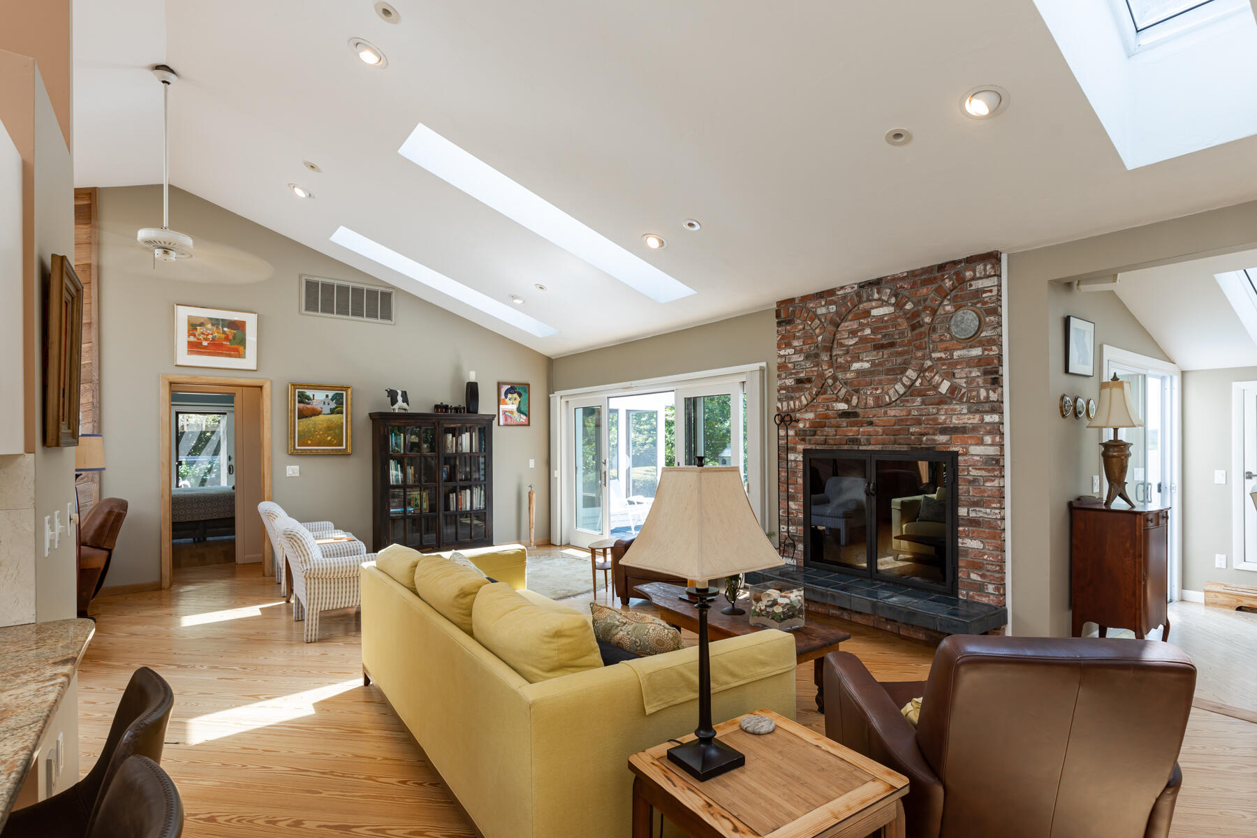 25 Adams Way Eastham, MA 02642 - Photo 14 of 60 a living room with furniture and a fireplace