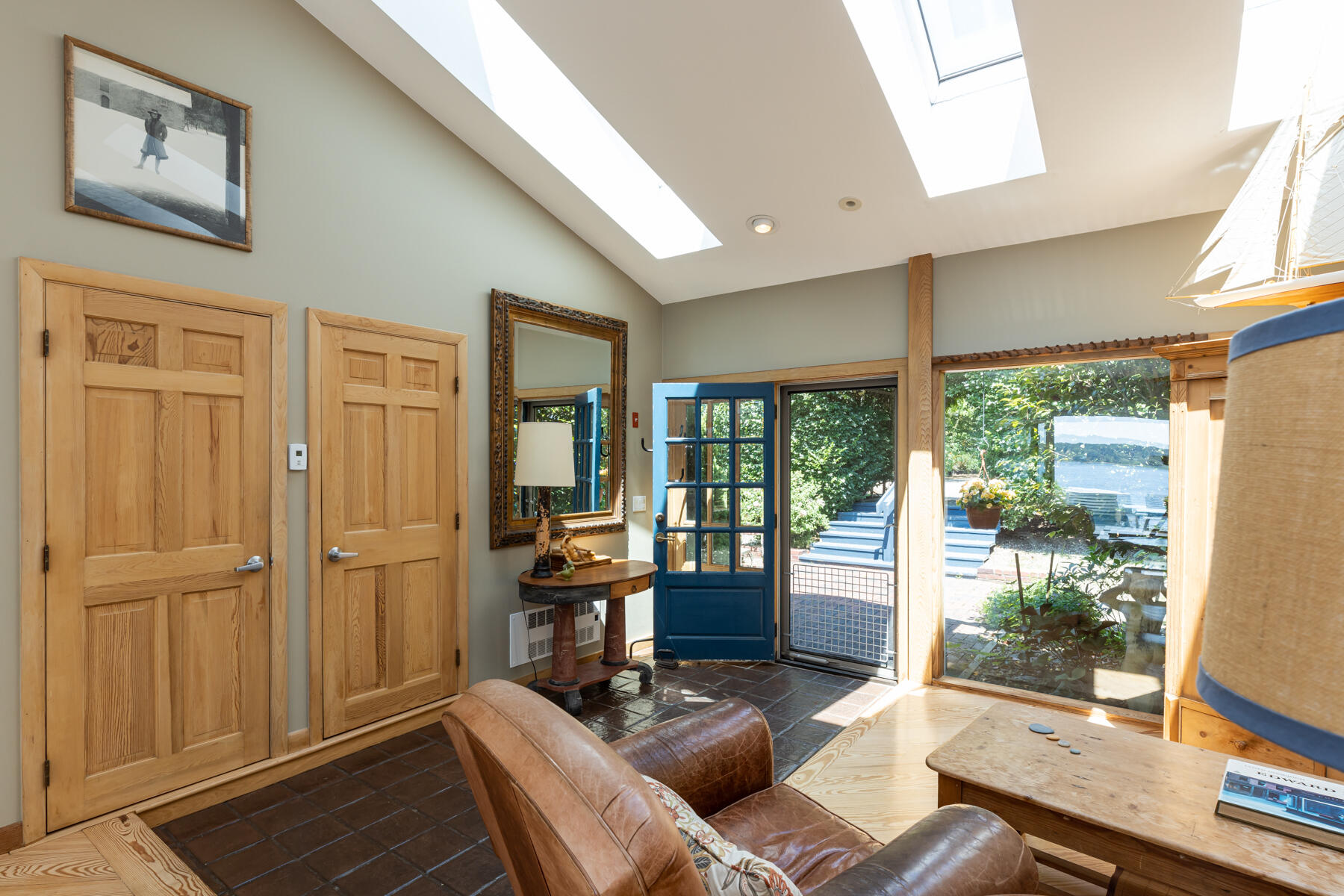 25 Adams Way Eastham, MA 02642 - Photo 15 of 60 a living room with furniture and large windows