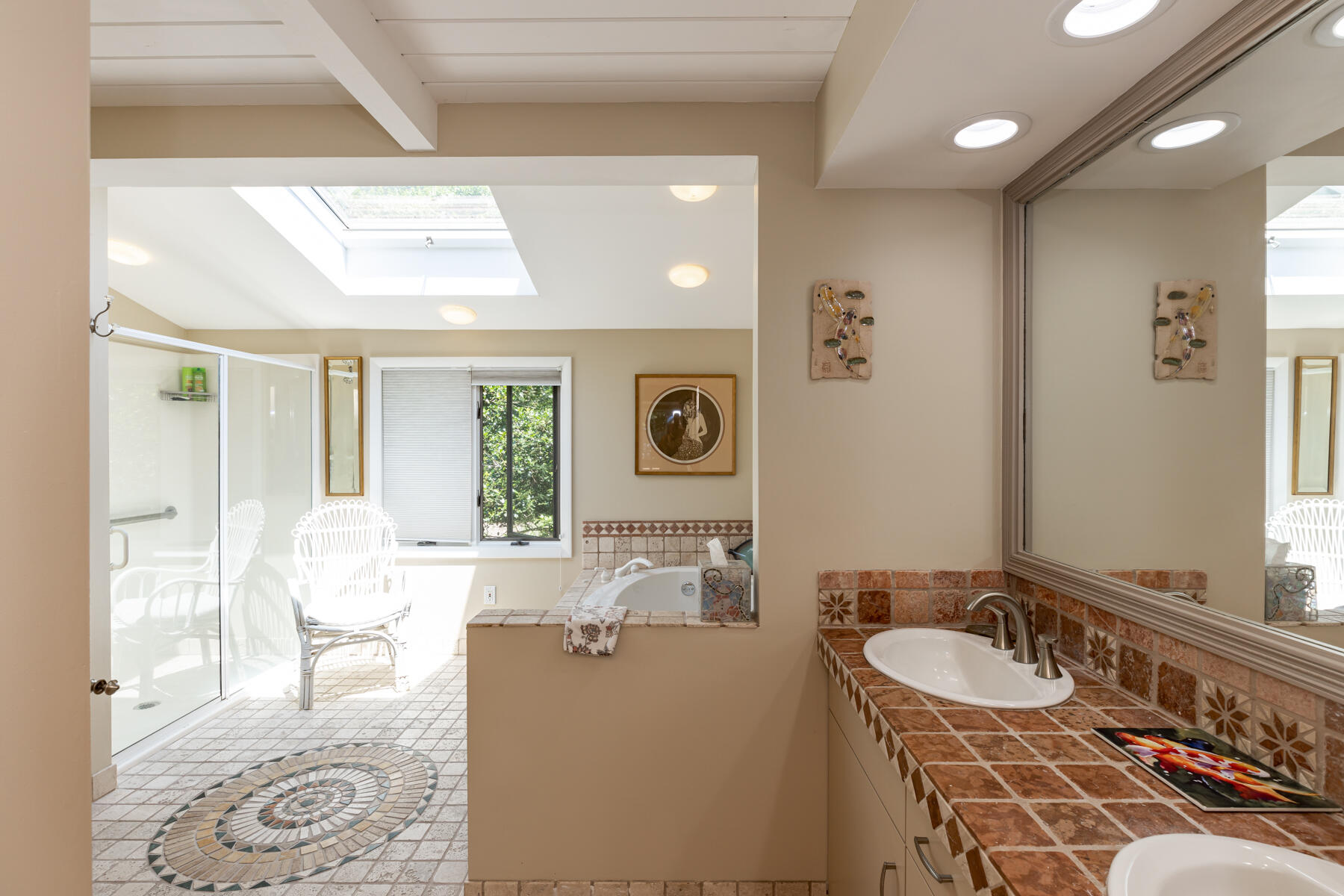 25 Adams Way Eastham, MA 02642 - Photo 22 of 60 a spacious bathroom with a tub sink and mirror