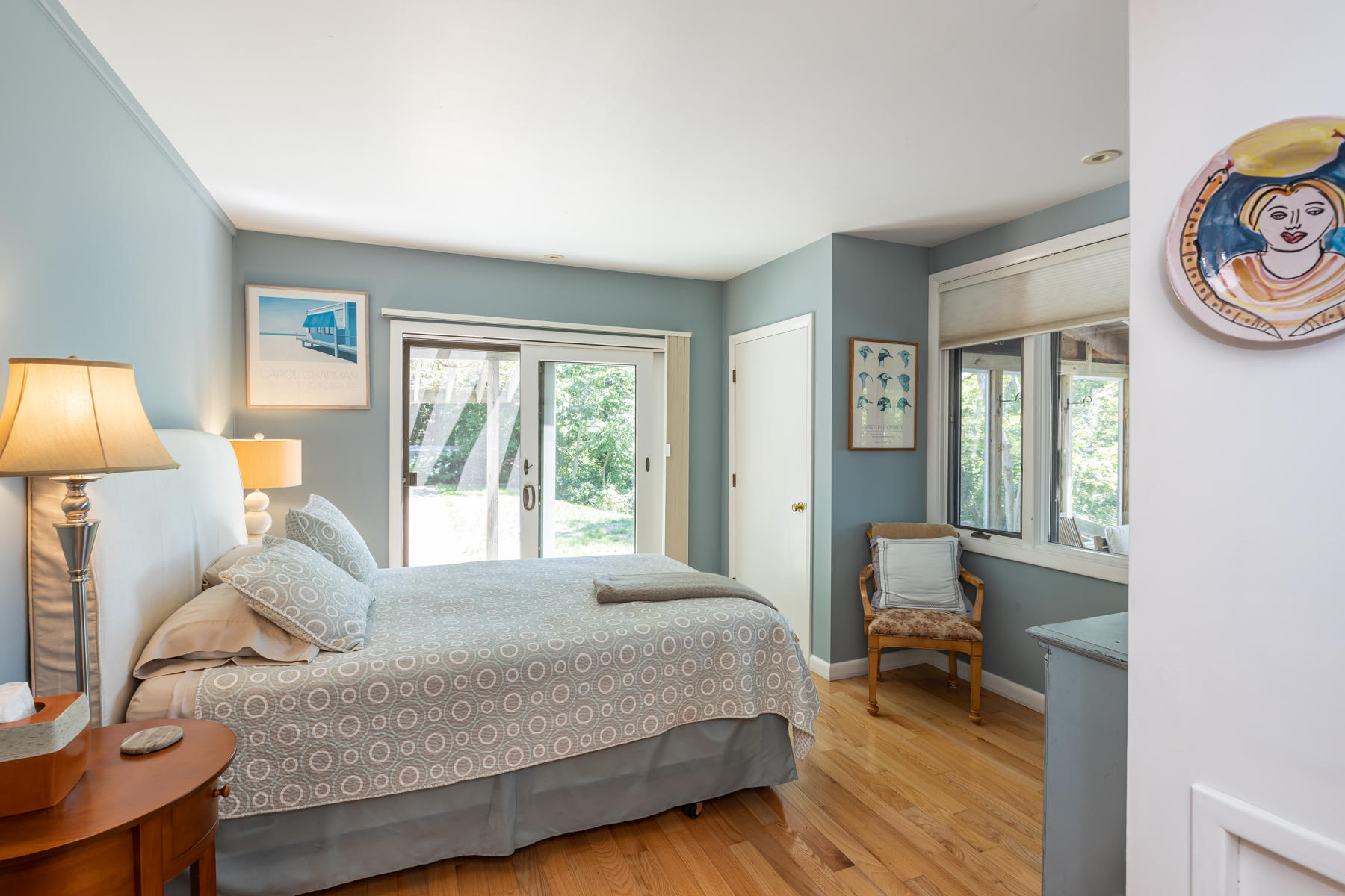 25 Adams Way Eastham, MA 02642 - Photo 26 of 60 a bed room with a bed and a lamp