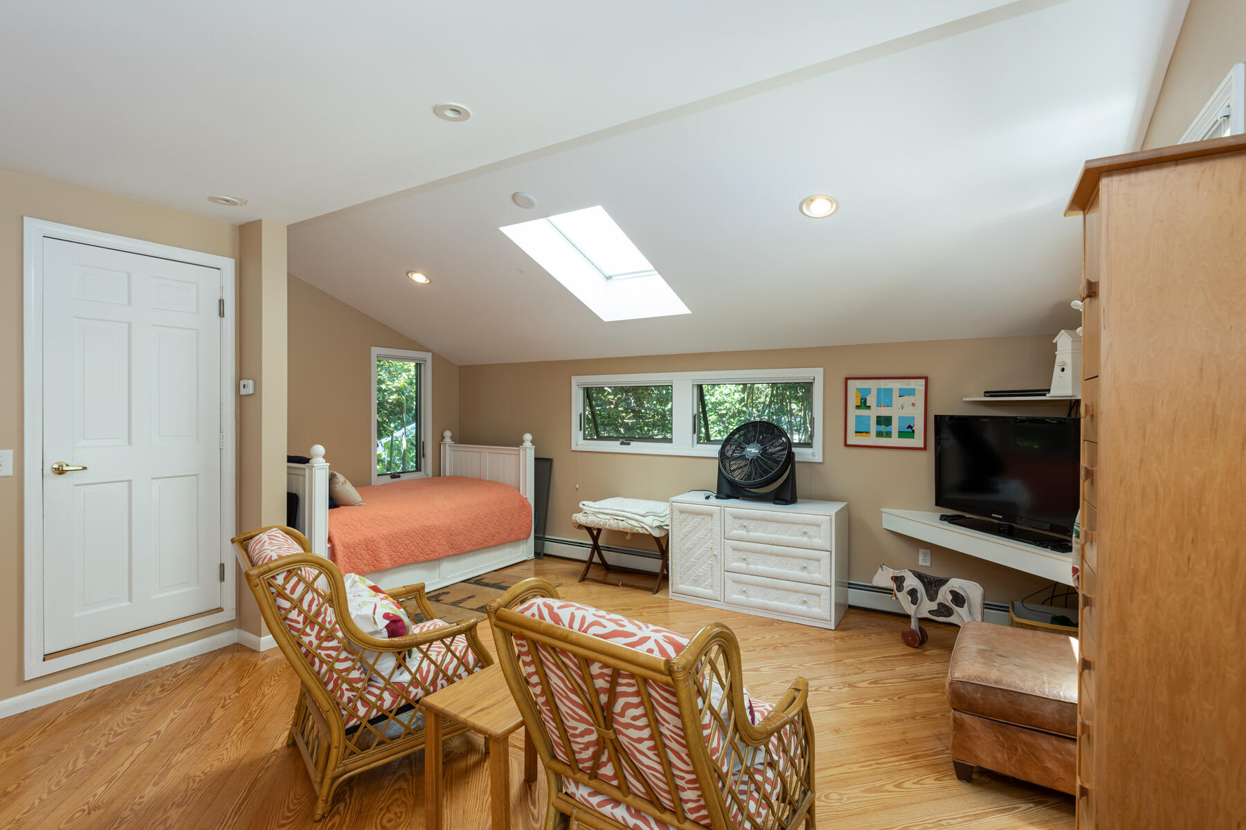 25 Adams Way Eastham, MA 02642 - Photo 30 of 60 a living room with furniture a flat screen tv and a refrigerator