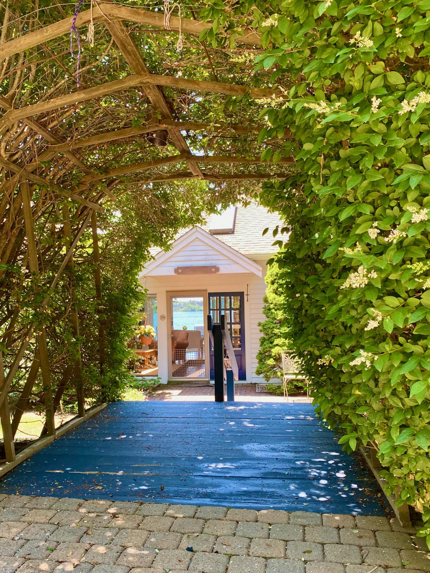 25 Adams Way Eastham, MA 02642 - Photo 3 of 60 a front view of a house with a yard