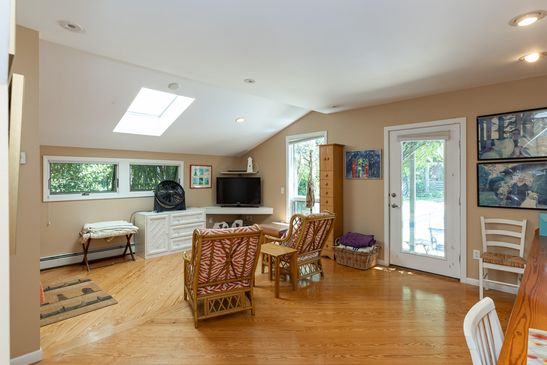 25 Adams Way Eastham, MA 02642 - Photo 31 of 60 a living room with furniture and a flat screen tv
