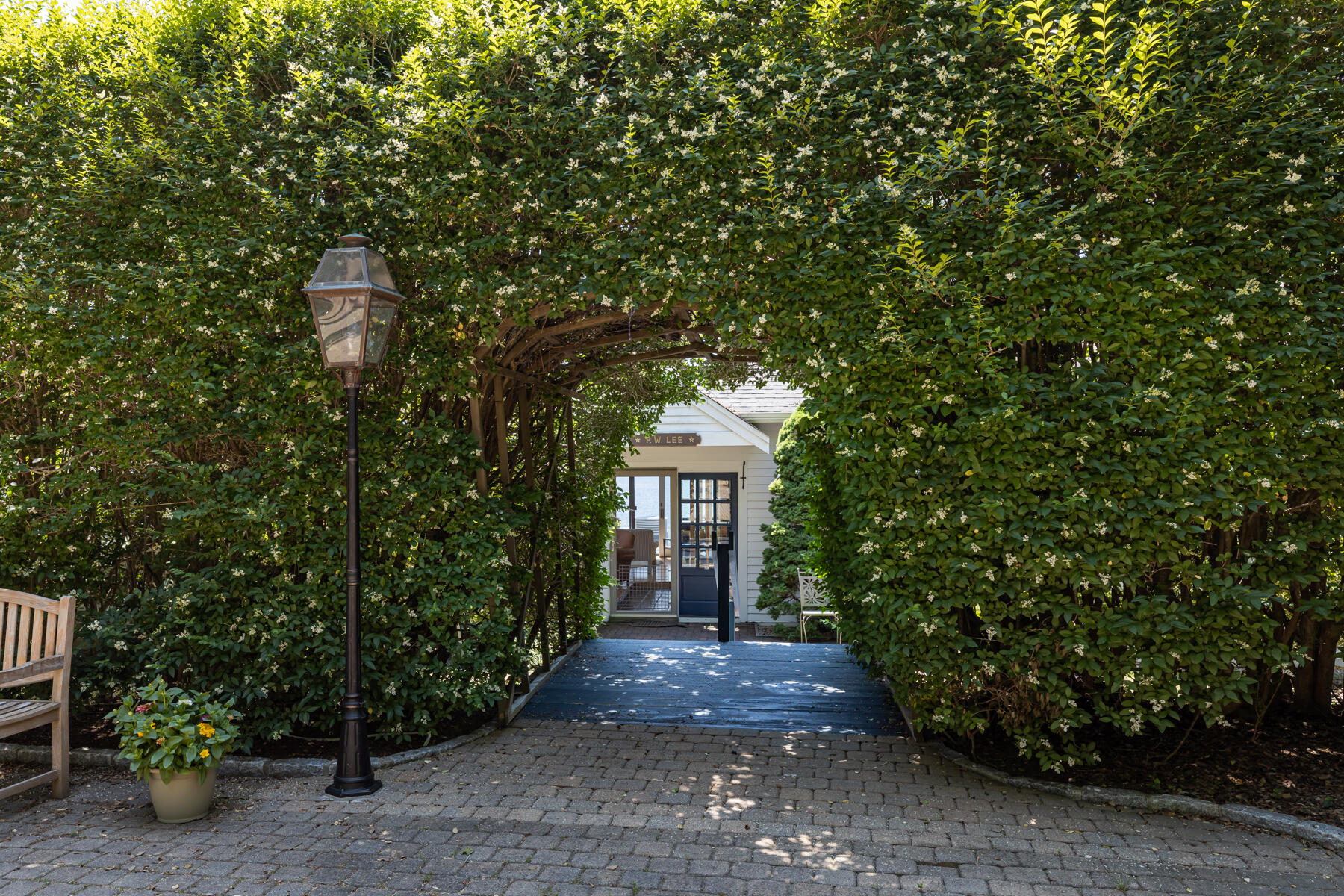 25 Adams Way Eastham, MA 02642 - Photo 43 of 60 a front view of a house with garden