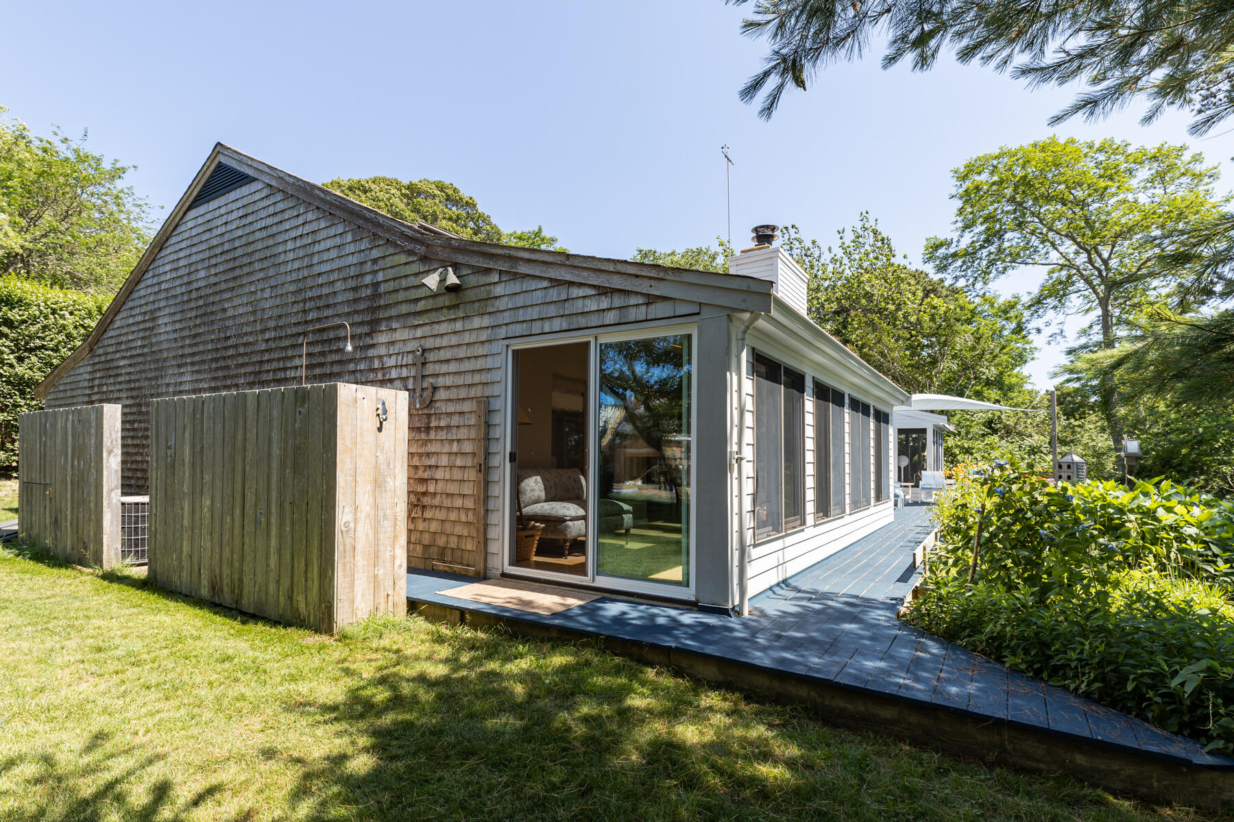 25 Adams Way Eastham, MA 02642 - Photo 58 of 60 a view of a house with wooden floor and a yard