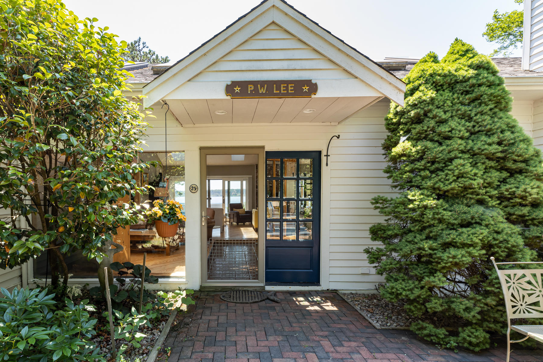 25 Adams Way Eastham, MA 02642 - Photo 6 of 60 a front view of a house with a yard