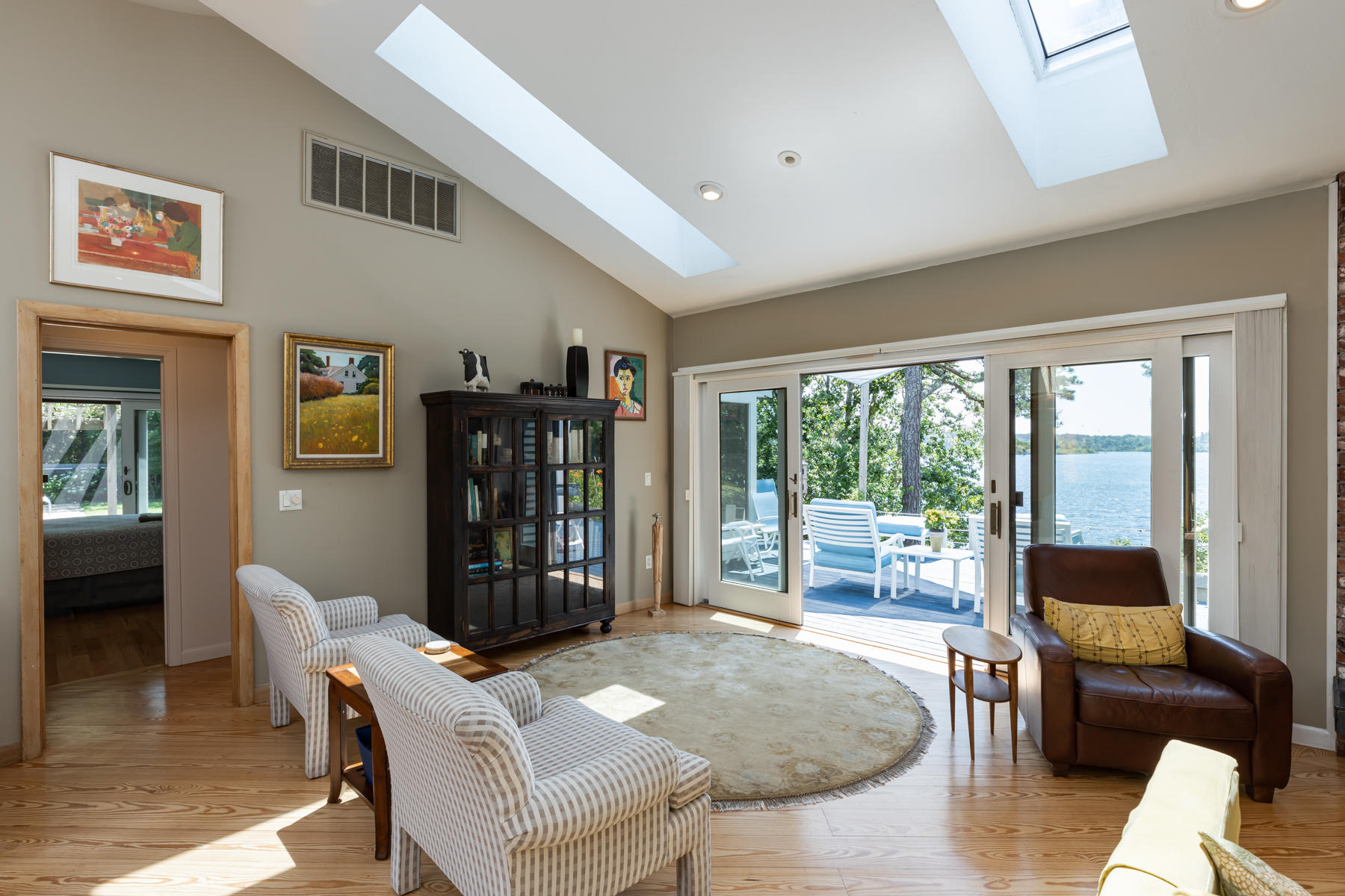 25 Adams Way Eastham, MA 02642 - Photo 7 of 60 a living room with fireplace furniture and a large window