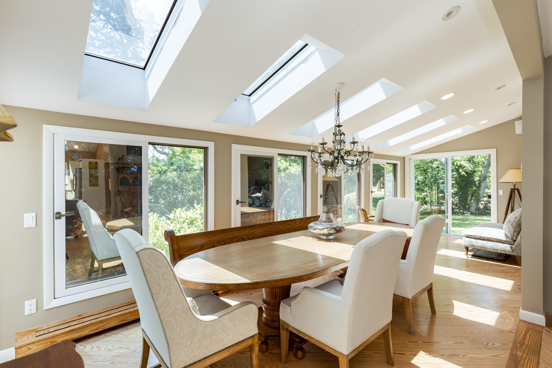 25 Adams Way Eastham, MA 02642 - Photo 9 of 60 a view of a dining room with furniture wooden floor and chandelier