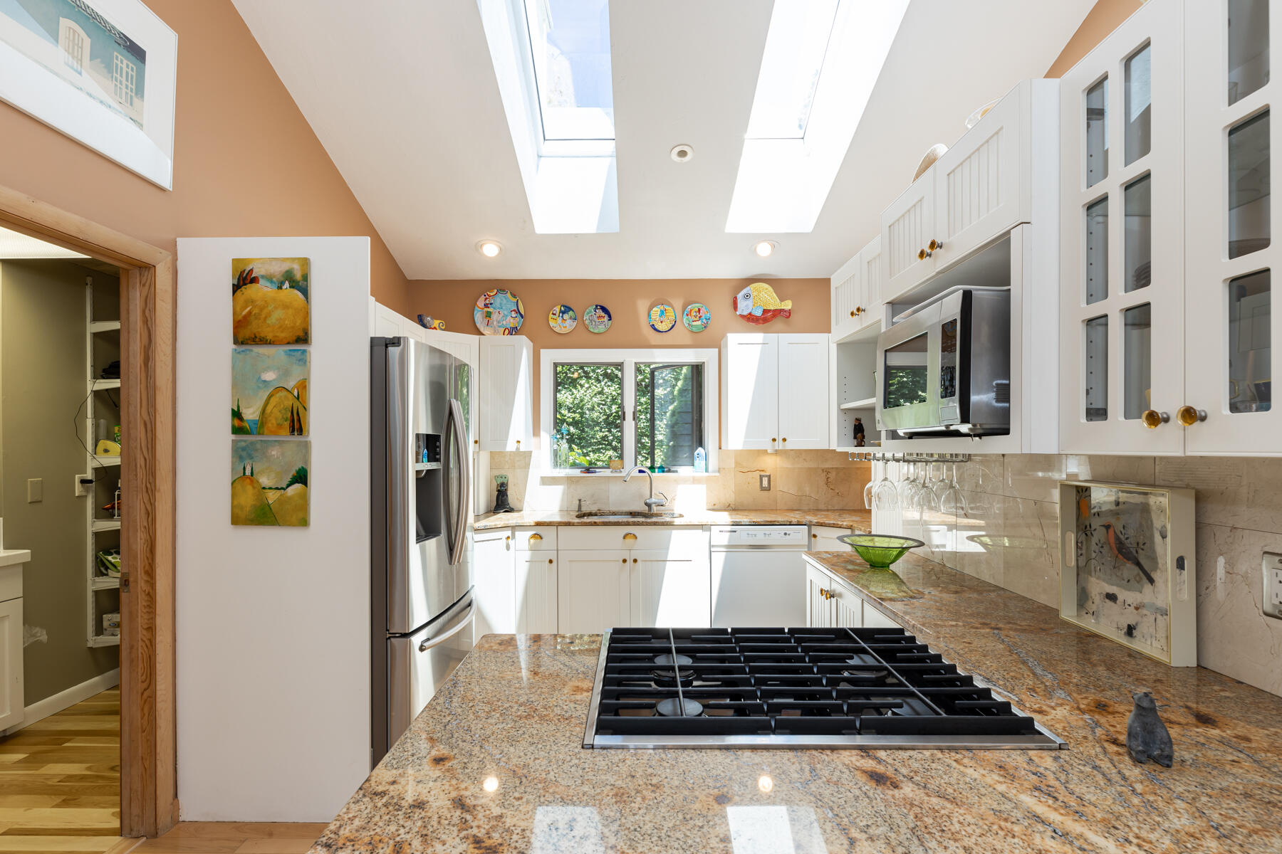 25 Adams Way Eastham, MA 02642 - Photo 10 of 60 a kitchen with a refrigerator a stove a washer dryer and cabinets