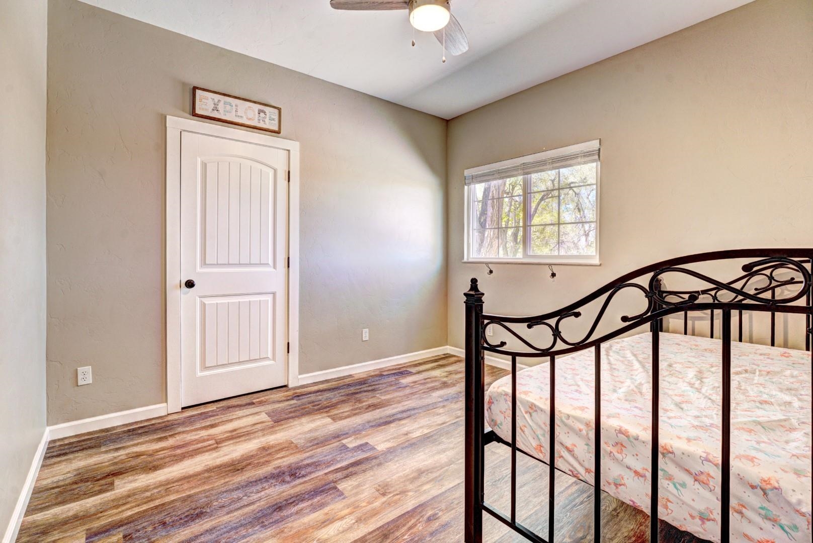 1151 19 Road Fruita, CO 81521 - Photo 8 of 25 a view of a hallway with a chandelier and a window
