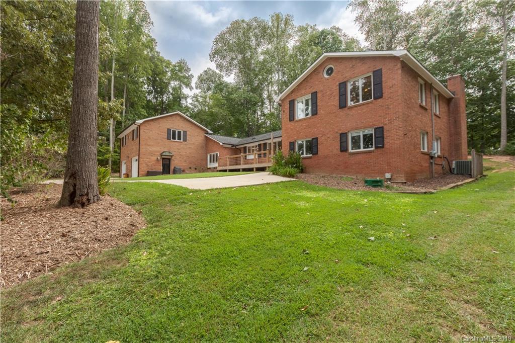 3515 Lake Shore Road South Denver, NC 28037 - Photo 2 of 46 a front view of a house with a yard and garage