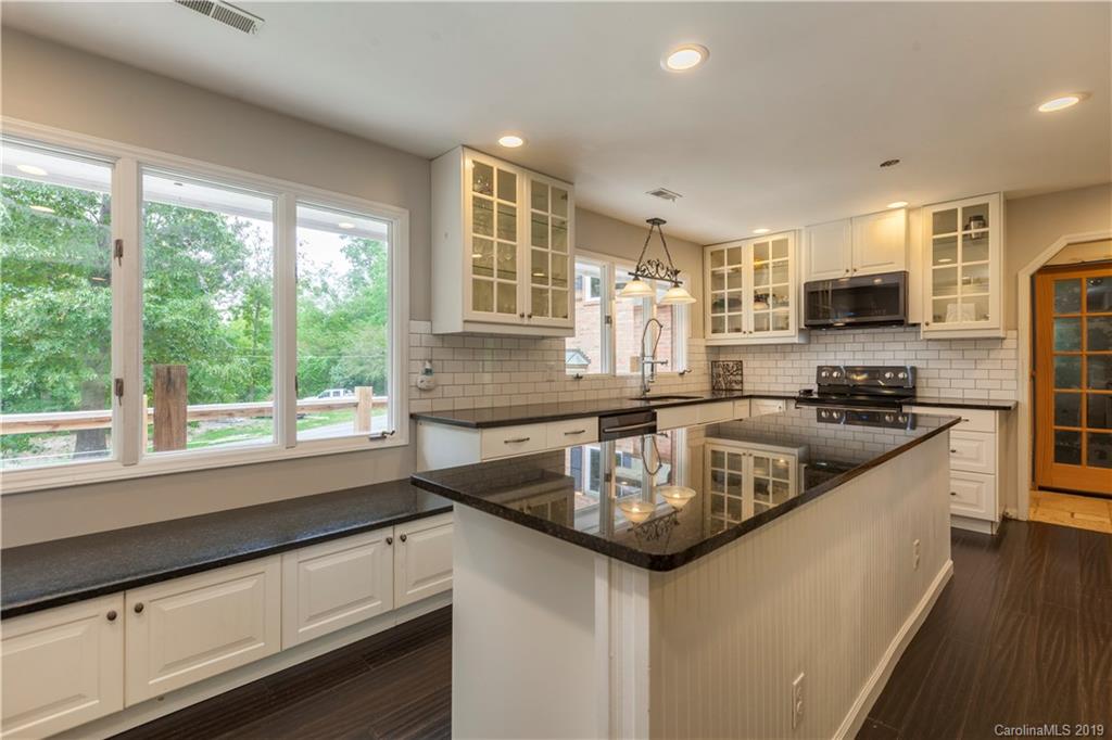3515 Lake Shore Road South Denver, NC 28037 - Photo 11 of 46 a kitchen with stainless steel appliances granite countertop a sink a stove and a refrigerator