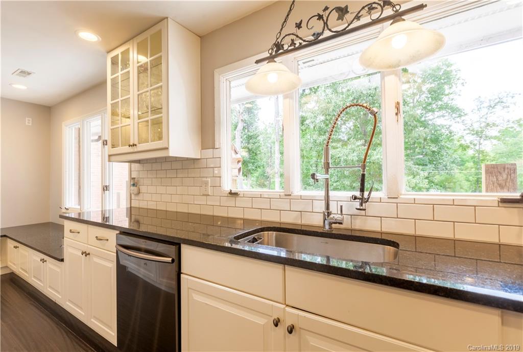3515 Lake Shore Road South Denver, NC 28037 - Photo 12 of 46 a kitchen with sink a window and cabinets