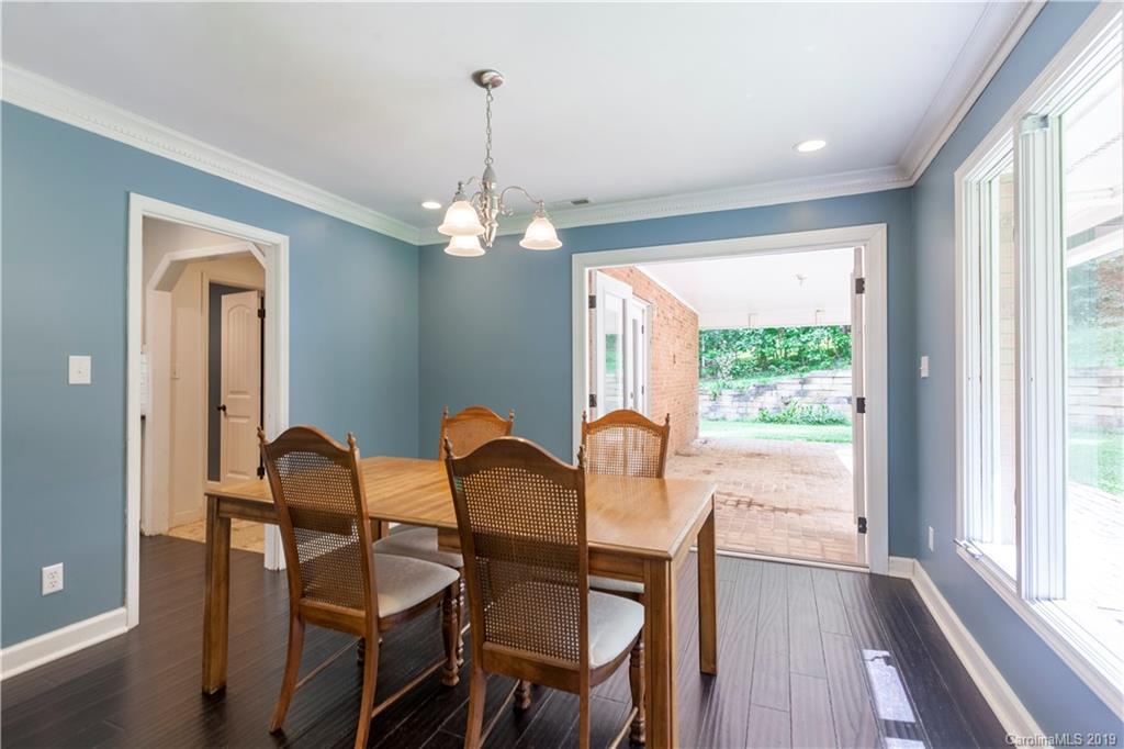 3515 Lake Shore Road South Denver, NC 28037 - Photo 14 of 46 a view of a dining room with furniture wooden floor and chandelier