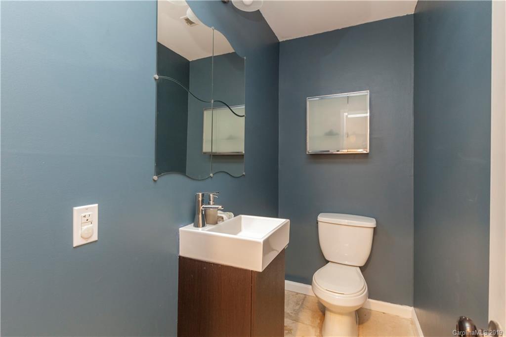 3515 Lake Shore Road South Denver, NC 28037 - Photo 17 of 46 a bathroom with a toilet sink and mirror