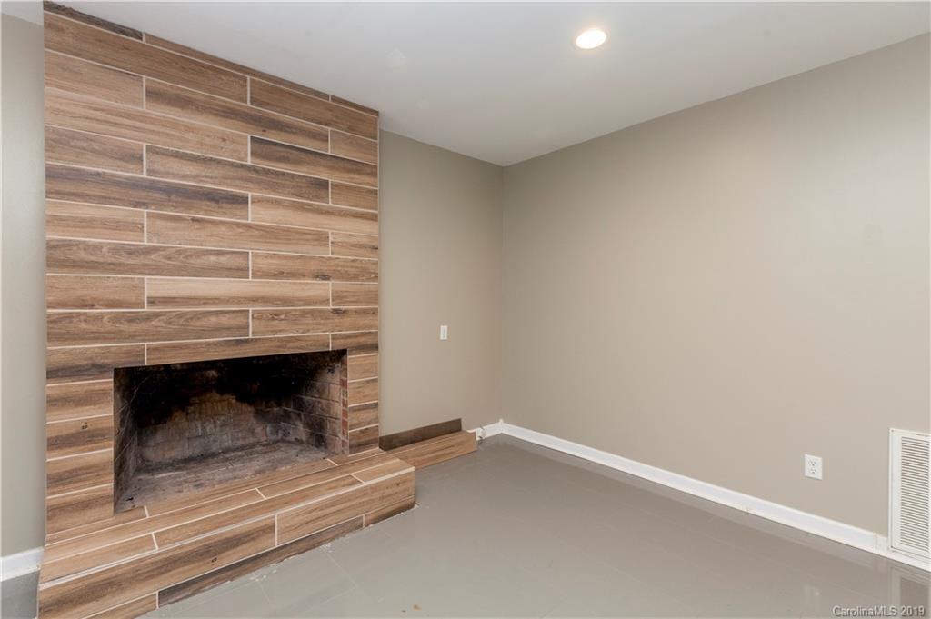 3515 Lake Shore Road South Denver, NC 28037 - Photo 20 of 46 a living room with a fireplace