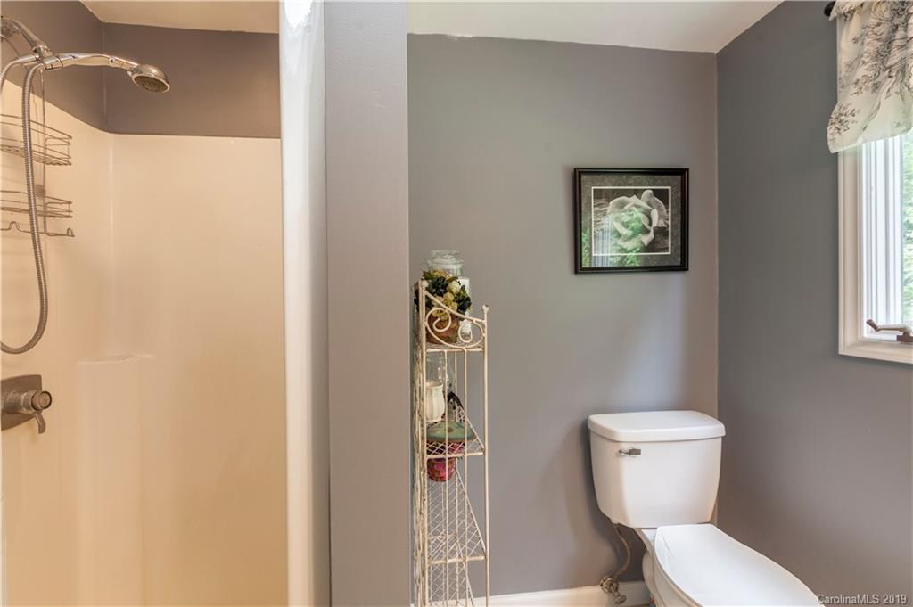 3515 Lake Shore Road South Denver, NC 28037 - Photo 27 of 46 a white toilet sitting next to a bathroom sink