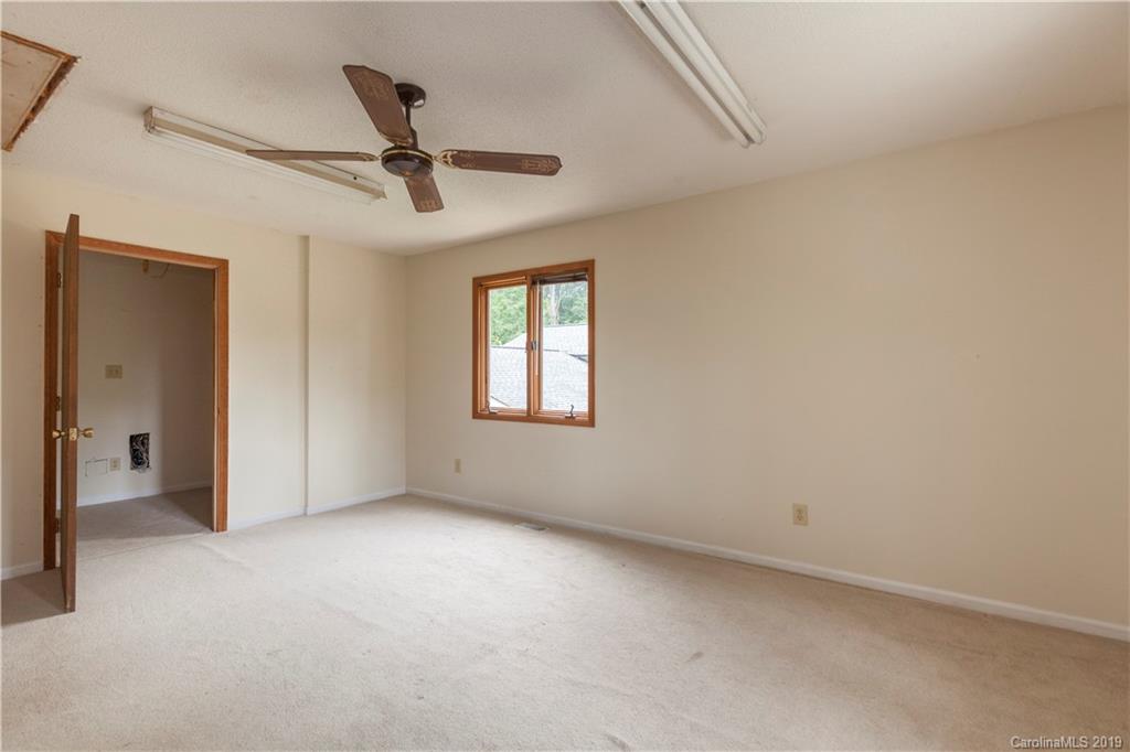 3515 Lake Shore Road South Denver, NC 28037 - Photo 32 of 46 an empty room with windows and fan