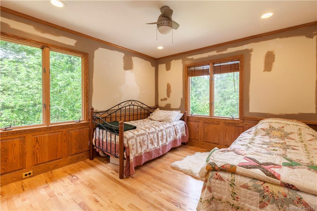 3515 Lake Shore Road South Denver, NC 28037 - Photo 38 of 46 a bedroom with bed and a large window