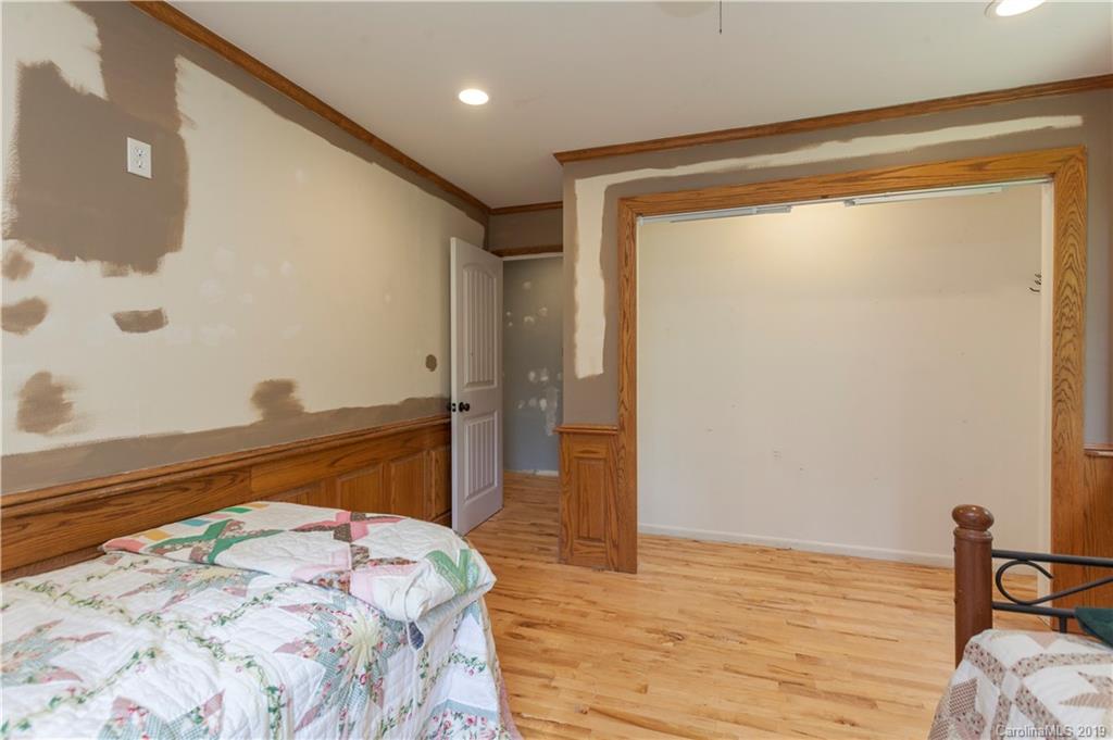 3515 Lake Shore Road South Denver, NC 28037 - Photo 39 of 46 a bedroom with a bed and a dresser