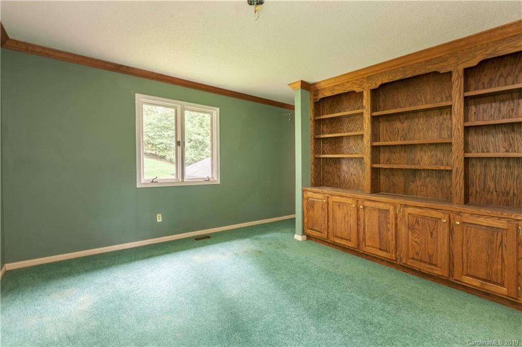 3515 Lake Shore Road South Denver, NC 28037 - Photo 40 of 46 a view of an empty room with cabinet and a window