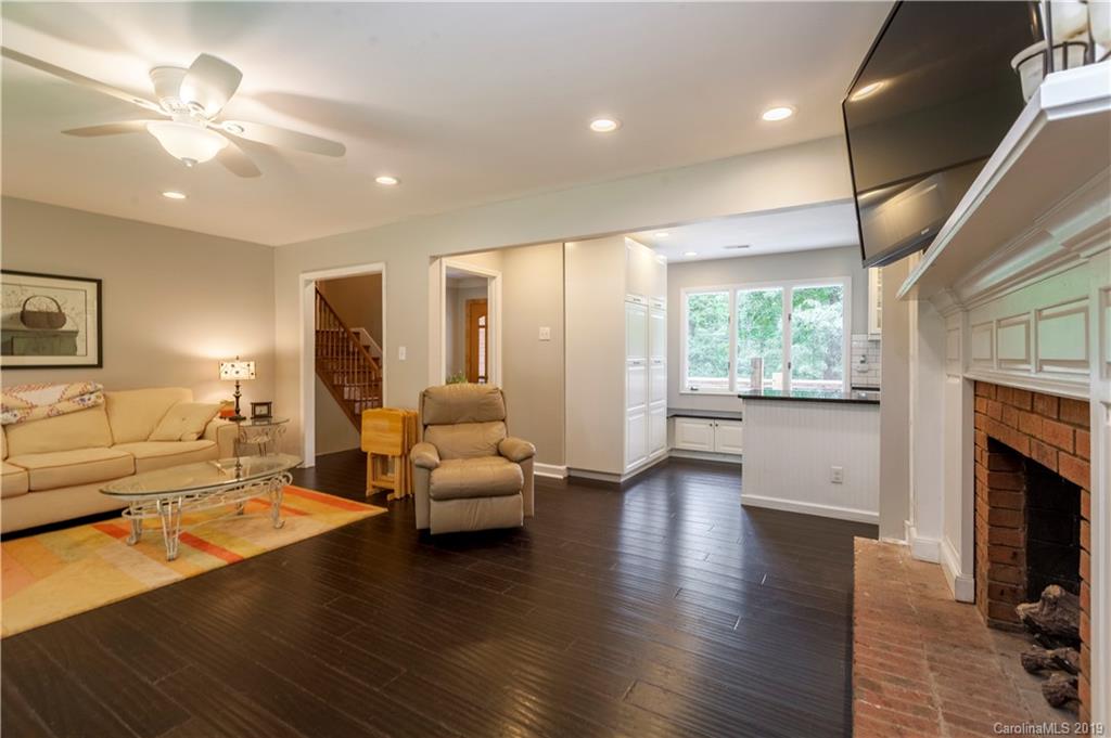 3515 Lake Shore Road South Denver, NC 28037 - Photo 6 of 46 a living room with furniture large window and a fireplace