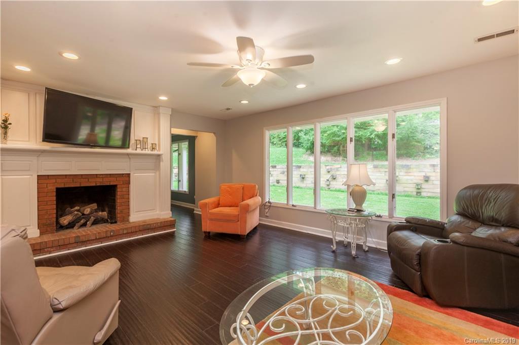 3515 Lake Shore Road South Denver, NC 28037 - Photo 7 of 46 a living room with furniture and a fireplace