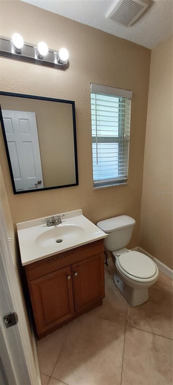 4131 Yorketowne Road Orlando, FL 32812 - Photo 21 of 53 Half Bathroom next to Laundry Room