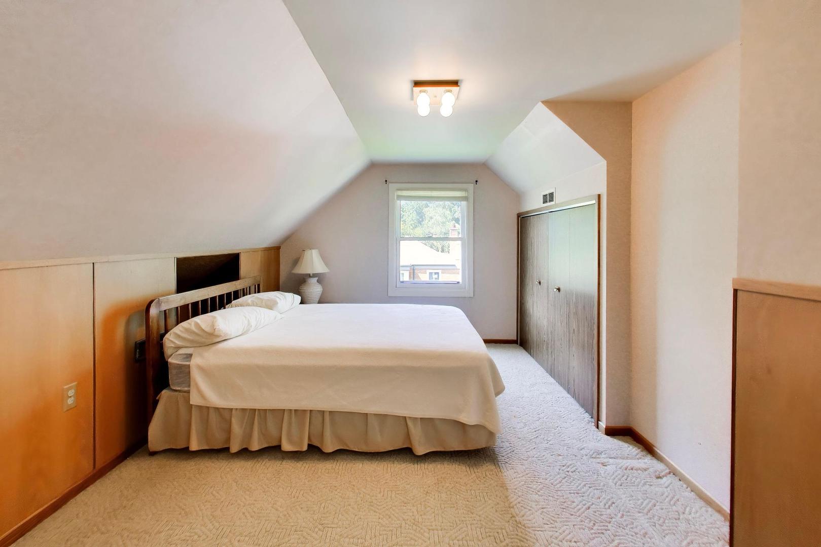 103 Cottonwood Road Northbrook, IL 60062 - Photo 32 of 50 a bedroom with a bed and window