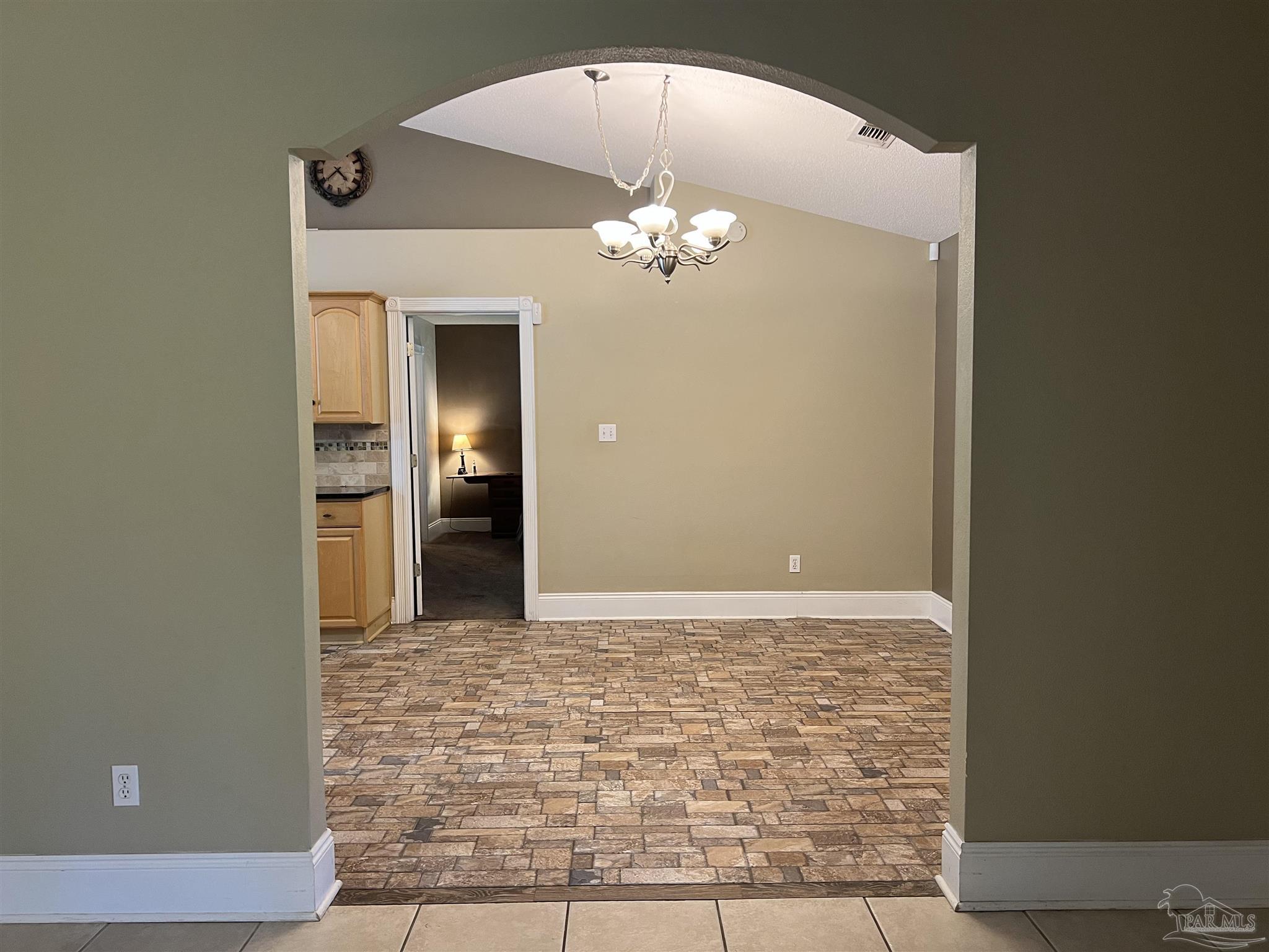 12465 Red Cloud Road Pensacola, FL 32507 - Photo 13 of 68 a view of a chandelier fan in a room