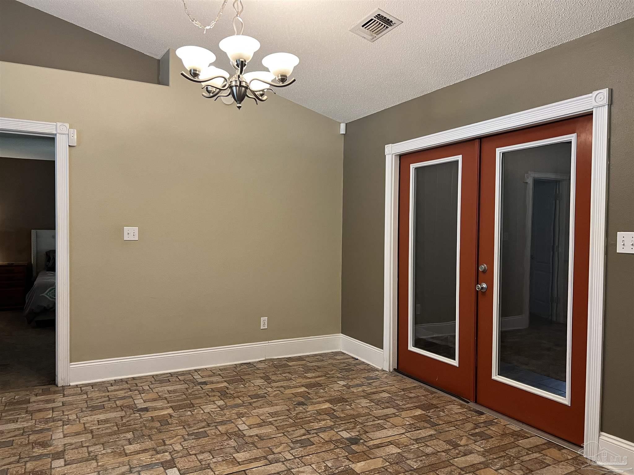 12465 Red Cloud Road Pensacola, FL 32507 - Photo 16 of 68 a view of an empty room with a window